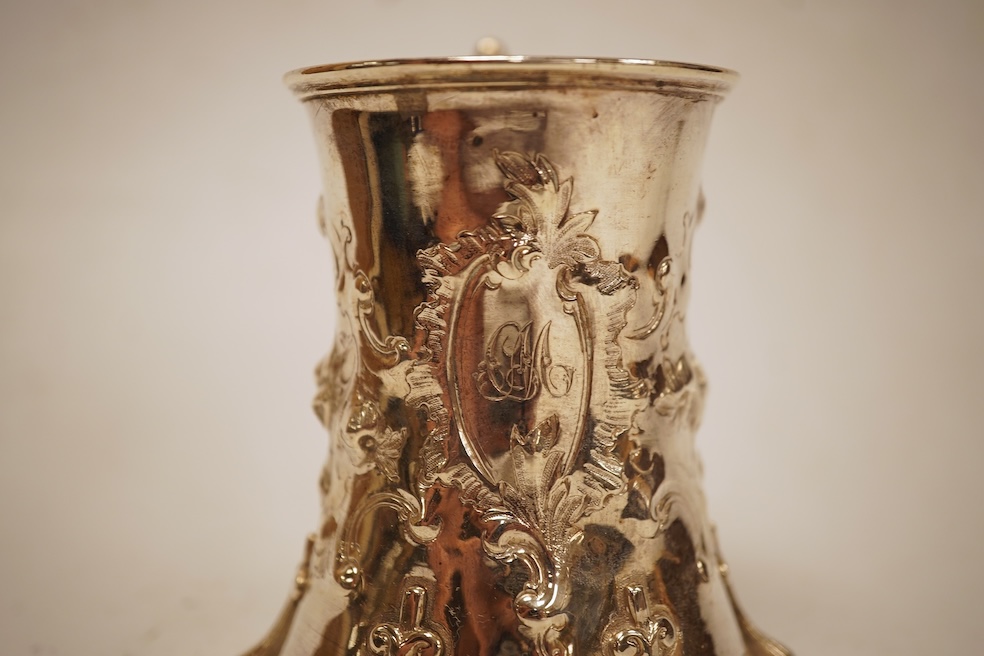 A Victorian embossed silver christening mug, of waisted form, by John Keith, London, 1851, height 10.2cm, 5.8oz.